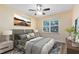 Bedroom with large bed and window seating at 10329 Belfry Cir, Orlando, FL 32832