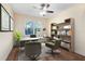 Home office with desk, chairs, and bookshelves at 10329 Belfry Cir, Orlando, FL 32832