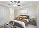 Serene main bedroom featuring a king-size bed, and a ceiling fan at 10329 Belfry Cir, Orlando, FL 32832