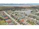 Aerial view of houses along a waterfront community at 1122 Hacienda Cir, Kissimmee, FL 34741