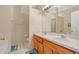 Bathroom features double sinks and wood cabinets at 1122 Hacienda Cir, Kissimmee, FL 34741