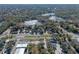 Aerial view showcasing home's location near lake and highway at 1254 Seminola Blvd, Casselberry, FL 32707