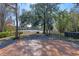 Spacious wooden deck overlooks tranquil lake view; string lights add ambiance at 1254 Seminola Blvd, Casselberry, FL 32707