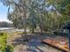 Lakefront backyard with wooden deck and lush landscaping at 1254 Seminola Blvd, Casselberry, FL 32707