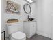 Stylish half bathroom with modern fixtures, vessel sink, and neutral decor at 1254 Seminola Blvd, Casselberry, FL 32707