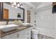 Updated bathroom features double sinks, stylish fixtures, and a tub-shower combination at 1254 Seminola Blvd, Casselberry, FL 32707
