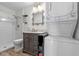 Modern bathroom featuring a washer/dryer combo, vanity, and walk-in shower at 1254 Seminola Blvd, Casselberry, FL 32707
