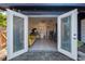 Modern living space with a kitchenette and stylish decor, illuminated by natural light at 1254 Seminola Blvd, Casselberry, FL 32707
