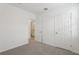 Bright bedroom with neutral walls and carpet, featuring ensuite bathroom access at 1373 Current Pl, Haines City, FL 33844