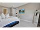 Comfortable bedroom with a king-size bed and a full-length mirror at 15913 Winding Bluff Dr, Montverde, FL 34756