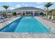 Community pool with lounge chairs and a relaxing atmosphere at 15913 Winding Bluff Dr, Montverde, FL 34756