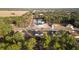 Scenic aerial view of a residential neighborhood with houses nestled among tall pine trees at 17031 Sw 20Th Court Rd, Ocala, FL 34473