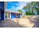 A spacious brick backyard with a modern design with lush green plants and outdoor hose at 1720 Overlook Rd, Longwood, FL 32750