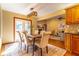 Bright dining room with wooden table and access to patio at 1720 Overlook Rd, Longwood, FL 32750