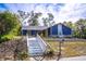 Newly renovated home with a charming white and blue exterior at 1720 Overlook Rd, Longwood, FL 32750