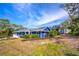 Blue house with detached shed and mature landscaping at 1720 Overlook Rd, Longwood, FL 32750