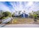 Ranch style home with blue siding, stone accents and a yellow door at 1720 Overlook Rd, Longwood, FL 32750