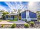 Bright blue home with stone accents and a welcoming yellow door at 1720 Overlook Rd, Longwood, FL 32750