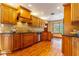 Modern kitchen with stainless steel appliances and wood cabinets at 1720 Overlook Rd, Longwood, FL 32750