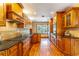 Modern kitchen with stainless steel appliances and wood cabinets at 1720 Overlook Rd, Longwood, FL 32750