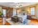 Main bedroom with hardwood floors, barn door, and ensuite bathroom at 1720 Overlook Rd, Longwood, FL 32750