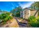 Exterior view of a painted shed with trees in the background, in need of some maintenance at 1720 Overlook Rd, Longwood, FL 32750