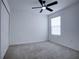 Bright bedroom with ceiling fan and carpet at 1726 Tree Shade Dr, Davenport, FL 33837