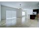 Spacious dining area with tile floors and large window at 1726 Tree Shade Dr, Davenport, FL 33837