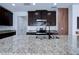 Granite countertops and modern dark brown cabinets at 1726 Tree Shade Dr, Davenport, FL 33837