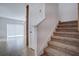 Beige carpeted staircase with wood accents at 1726 Tree Shade Dr, Davenport, FL 33837