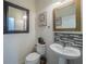 Chic half bathroom with pedestal sink at 17454 Chateau Pine Way, Clermont, FL 34711