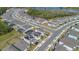 Aerial view of a house with a pool and solar panels in a residential area at 17584 Saw Palmetto Ave, Clermont, FL 34714