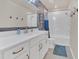 Clean bathroom with white cabinets, quartz countertop, and tub at 17584 Saw Palmetto Ave, Clermont, FL 34714