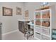 Laundry room with utility sink, storage cabinets and shelving at 17584 Saw Palmetto Ave, Clermont, FL 34714