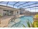 Inviting pool and patio with covered seating at 17584 Saw Palmetto Ave, Clermont, FL 34714