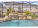 Relaxing pool area with a waterfall feature at 17584 Saw Palmetto Ave, Clermont, FL 34714