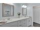 Modern bathroom with double vanity and a walk-in shower at 20620 Maxim Pkwy, Orlando, FL 32833