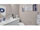 Small bathroom with white vanity and decorative artwork at 20620 Maxim Pkwy, Orlando, FL 32833