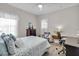 Bedroom with a queen-size bed, dresser, and home office area at 20620 Maxim Pkwy, Orlando, FL 32833