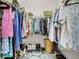 Walk-in closet with clothing, shoes, and shelving at 20620 Maxim Pkwy, Orlando, FL 32833