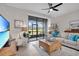 Living room with patio doors leading to a view of golf course at 20620 Maxim Pkwy, Orlando, FL 32833