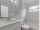 Modern bathroom with marble-look walls and white vanity at 2201 Kentucky Derby Dr, Orlando, FL 32825