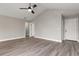 Large bedroom with vinyl plank flooring and neutral gray walls at 2201 Kentucky Derby Dr, Orlando, FL 32825