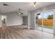 Dining area with vinyl plank flooring and sliding glass doors leading to the backyard at 2201 Kentucky Derby Dr, Orlando, FL 32825