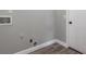 Laundry room with gray walls and vinyl flooring at 2201 Kentucky Derby Dr, Orlando, FL 32825