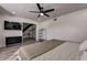 Bright bedroom with a comfortable bed and a large TV at 2540 Albany Dr, Kissimmee, FL 34758