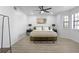 Spacious bedroom with a ceiling fan and wood-look floors at 2540 Albany Dr, Kissimmee, FL 34758