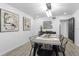 Modern dining room with black chairs and a stylish chandelier at 2540 Albany Dr, Kissimmee, FL 34758