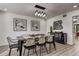 Modern dining room with black chairs and a stylish chandelier at 2540 Albany Dr, Kissimmee, FL 34758