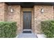 Black front door on a brick home at 2540 Albany Dr, Kissimmee, FL 34758